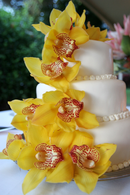 wedding cake with yellow orchids