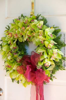 green cymbidium orchid wreath with hot pink bow