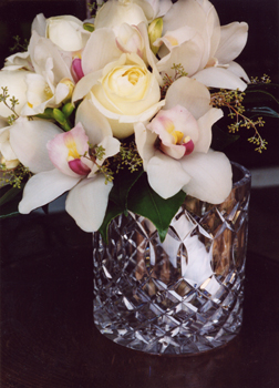 cream roses with white orchids in brides flowers